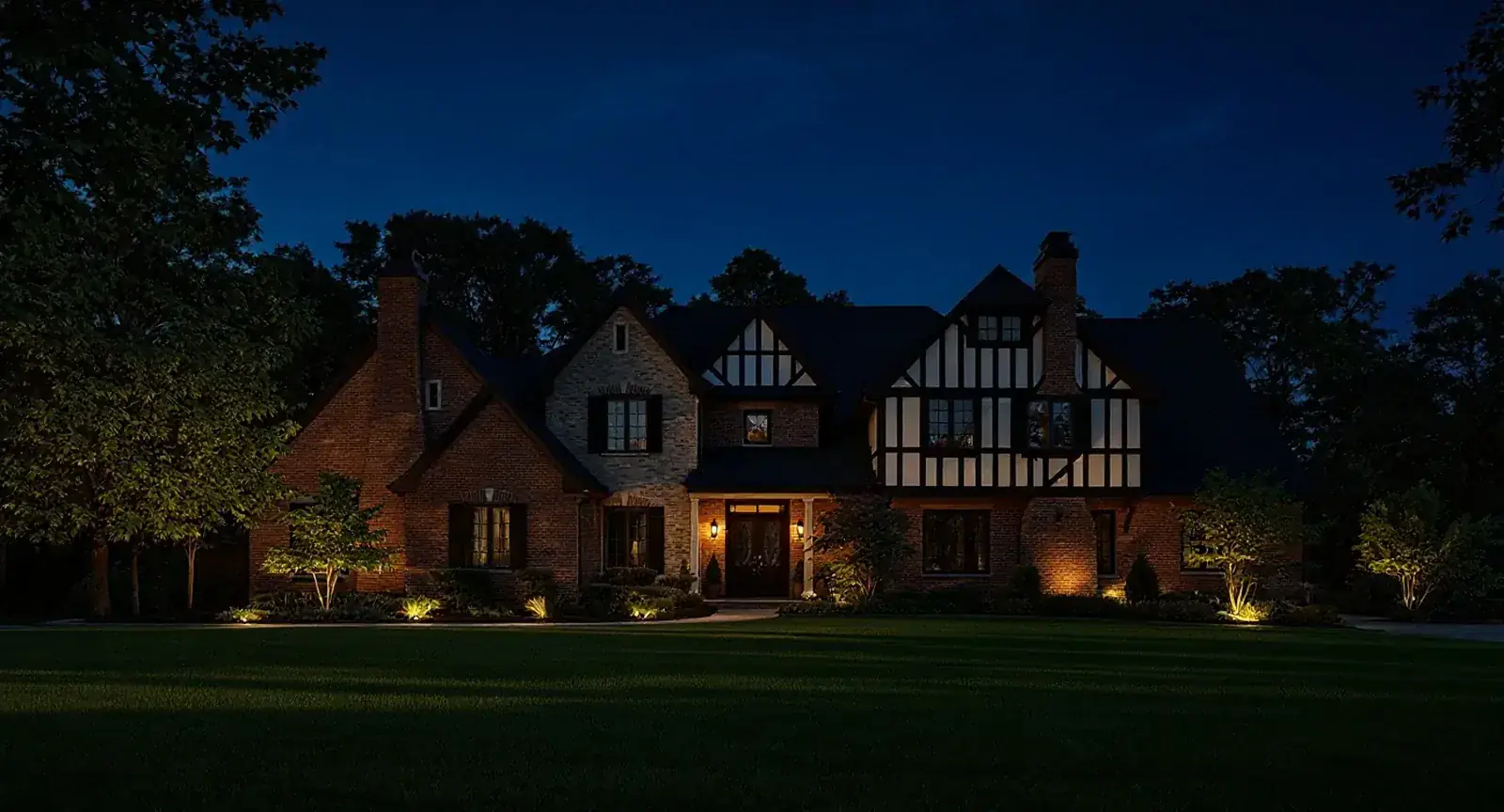 The same Hendersonville lakefront landscape lit after dark