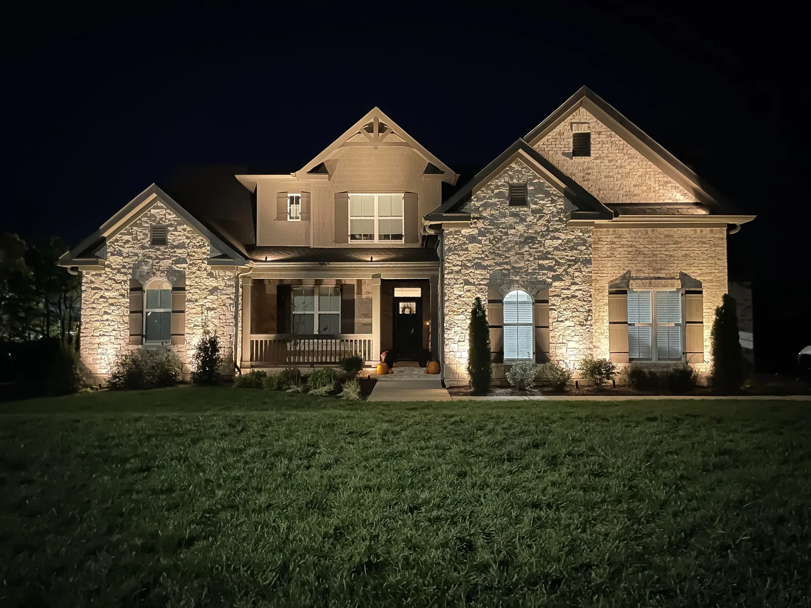 Up-lighting on a brick-and-stone facade