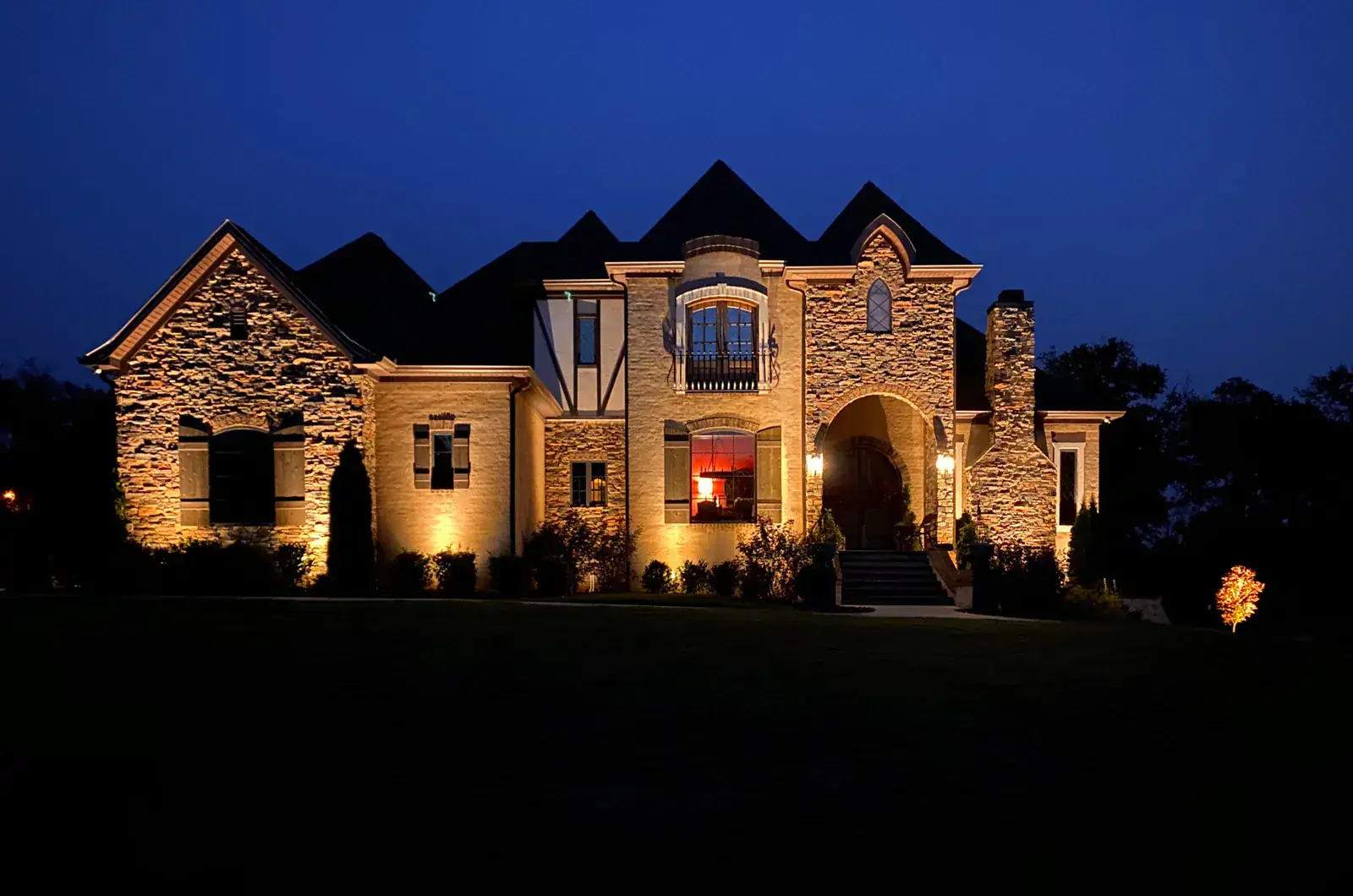Stone estate up-lighting at blue hour, Hendersonville