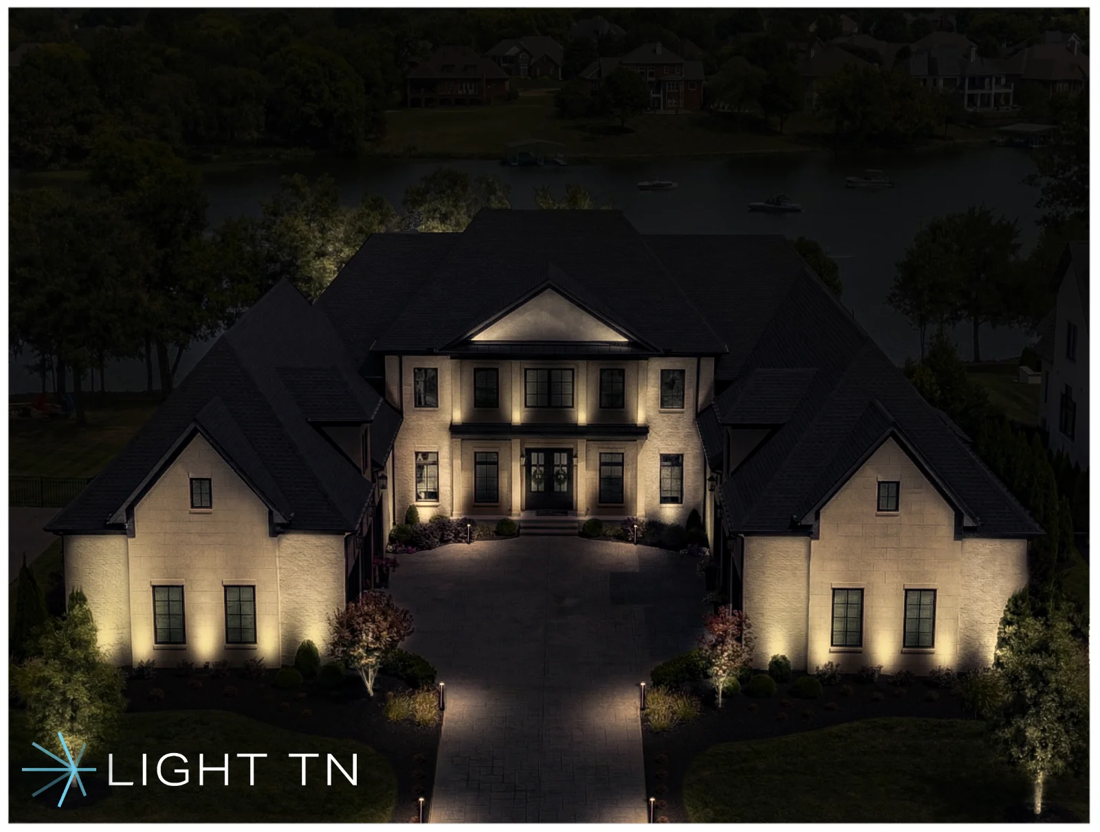 A Light TN rendering of a lit estate at night, showing layered landscape and architectural lighting