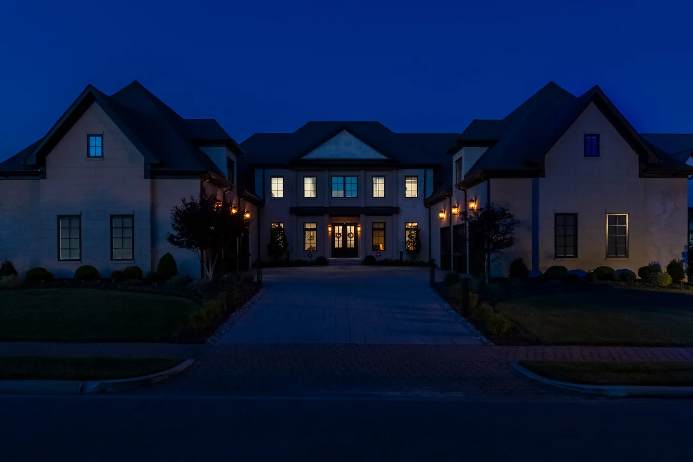 A large Middle Tennessee estate at night without architectural lighting