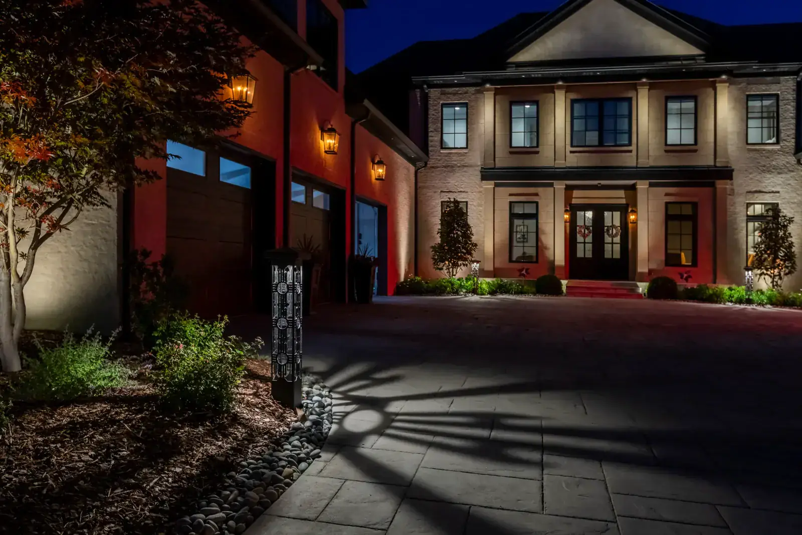 Driveway bollard and architectural lighting at night on a Hendersonville estate