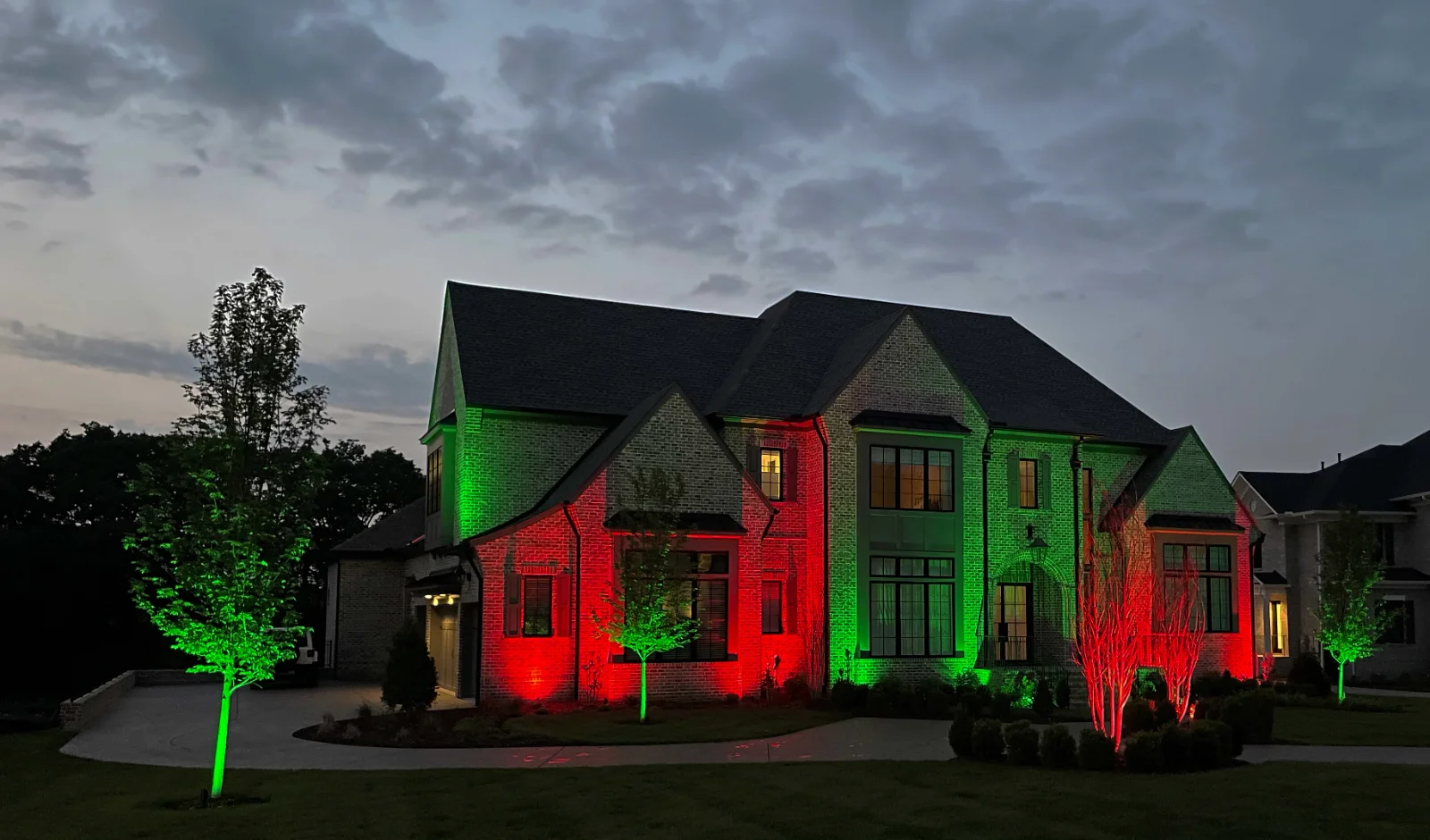 A Middle Tennessee home lit with red and green smart lighting scenes by Light TN