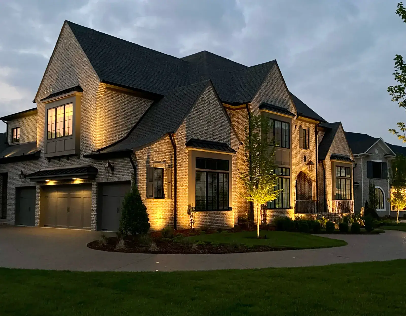 A Middle Tennessee home lit with red and green smart lighting scenes by Light TN